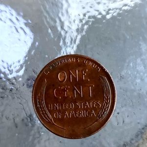 1953 penny with the wheat logo on it.